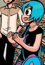 Ramona wearing a black tank top and purple skirt with black stockings